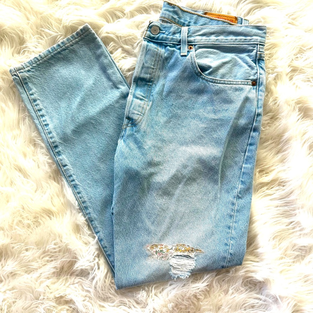 Levi's Light Wash Blue High-Waisted Jeans with Distressed Detail